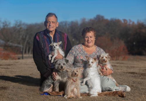 Betsie Bolger, Jon Mott and their dogs; Coco is second from right. Photo by Tanya Lee Photography 500