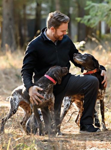 Veterinarian Seth Bynum with his dogs Shine and River - Purina First Aid article
